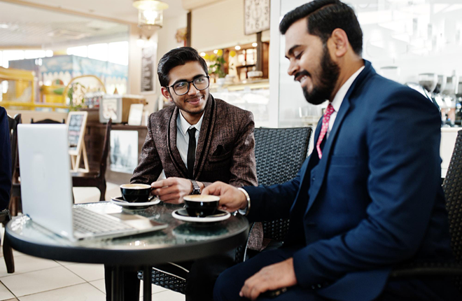 Two businessmen discussing loan options